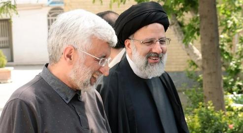 Ex-nuclear negotiator Saeed Jalili is expected by some analysts to function as a "mouthpiece" for fellow candidate Ebrahim Raeesi, right, in upcoming presidential election debates