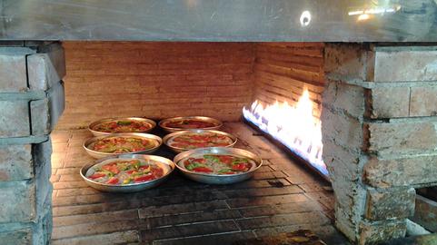پناهندگان سوری در قم پیتزا می‌فروشند