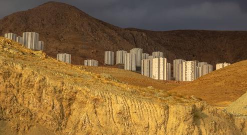 Empty, unfinished buildings in the desert after the collapse of Mahmoud Ahmadinejad's flagship Mehr Housing Project