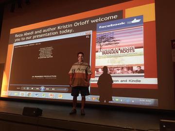 Reza presenting at a local university
