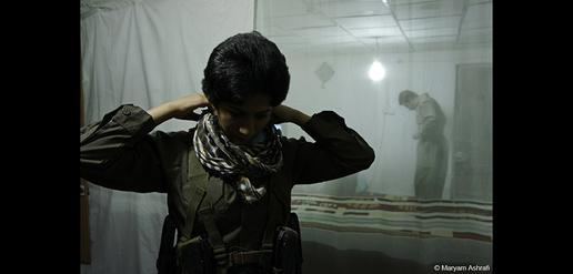 Peshmerga prepare for guard duty.