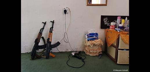 Guns and toiletries are seen in the room where 22-year-old Peshmerga Kohistan lives. Sulaymaniyah, Iraq.