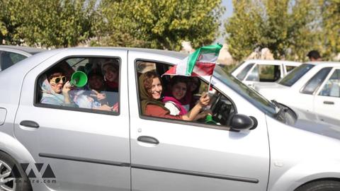 Fans arrived at the stadium in a festive mood, many of them with vuvuzelas and Iranian flags