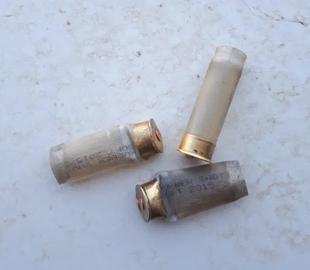 A gauge-12 shell, containing a rubber bullet with a metal core