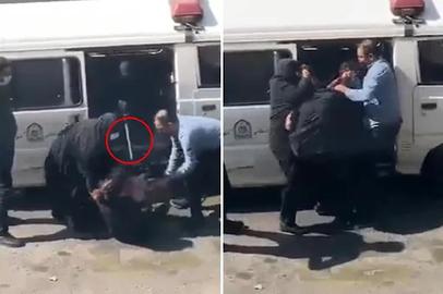 A real woman being detained with a catchpole and forced into a van by morality police in Iran last autumn